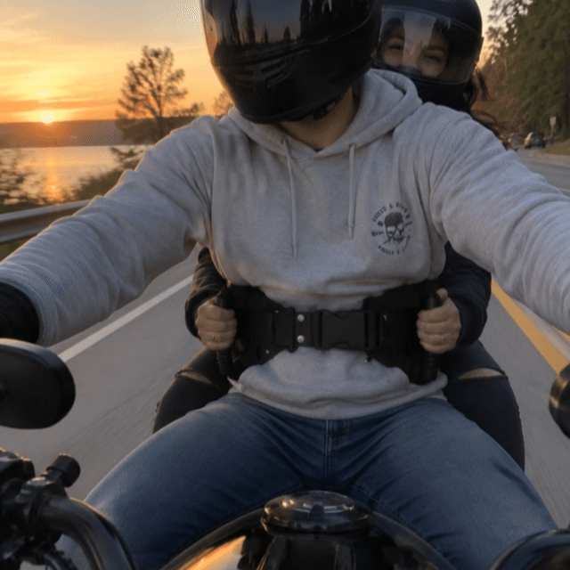 With GripEase: passenger holding the padded grip handles