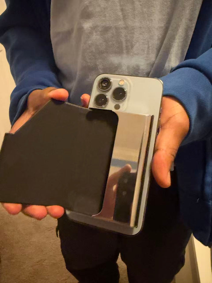 Customer photo holding the phone with the holder